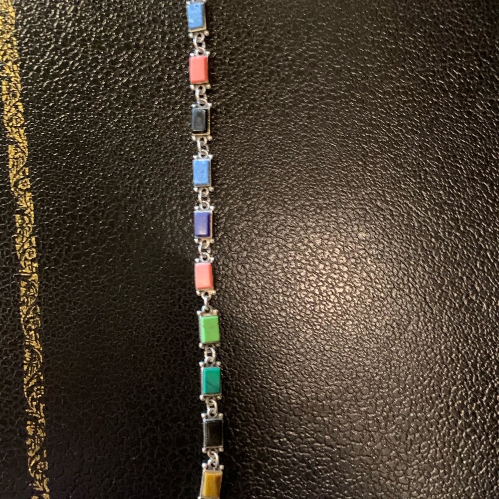 Silver bracelet with multiple colored stones